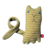 yello and white zig zag pattern toy cat on white background