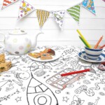 colour-in tablecloth with bunting and colouring pencils