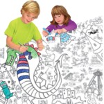 girl and boy colouring together at table