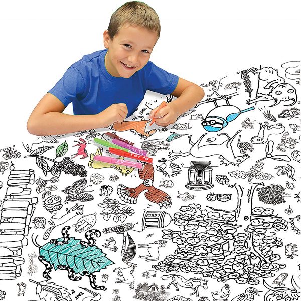 boy at table colouring in tablecloth