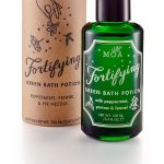 green bottle and tube on white background