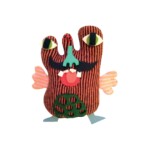 home made monster using craft bits on white background