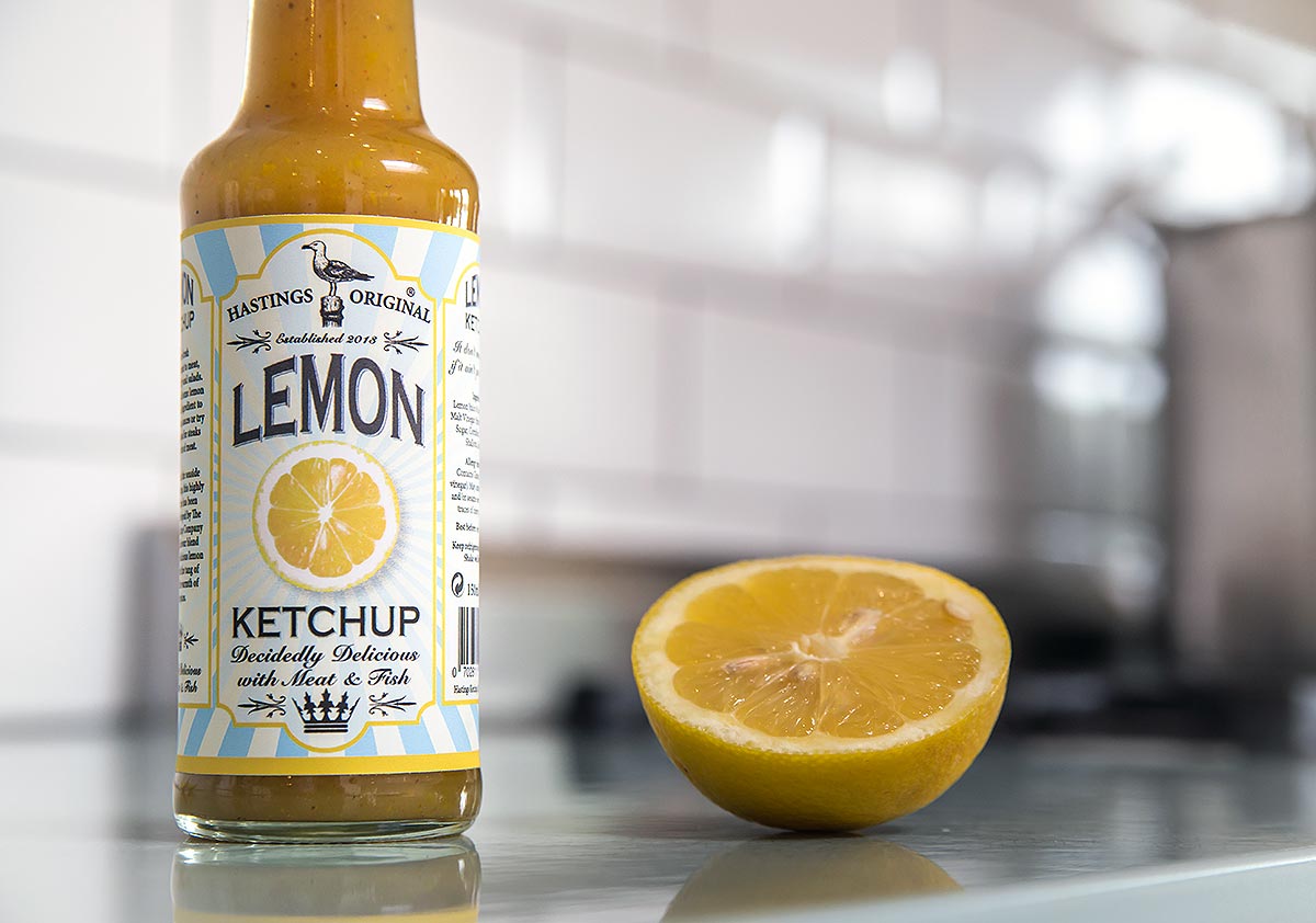 glass bottle on counter with cut lemon