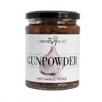 glass jar full of chutney on white background