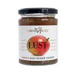 full glass jar of chutney on white background