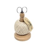 string stand and scissors on white background