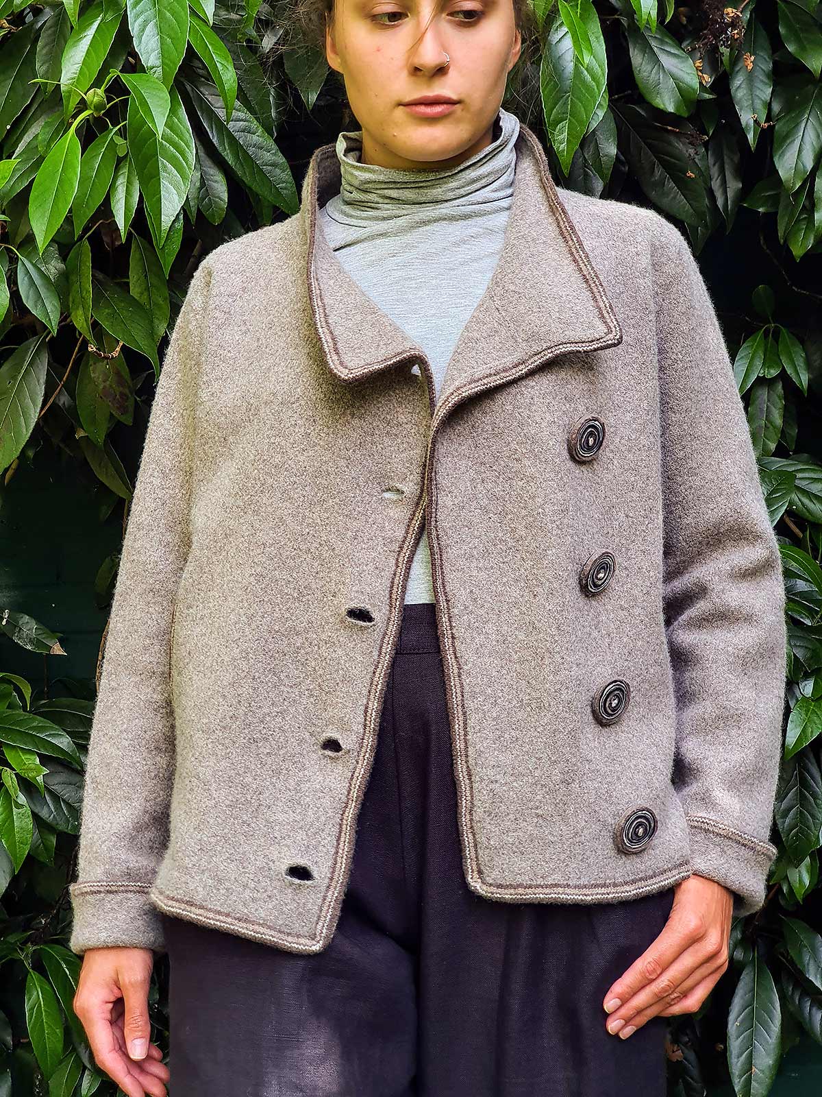 woman wearing jacket in garden