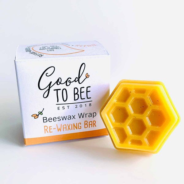 beeswax bar and box on white background