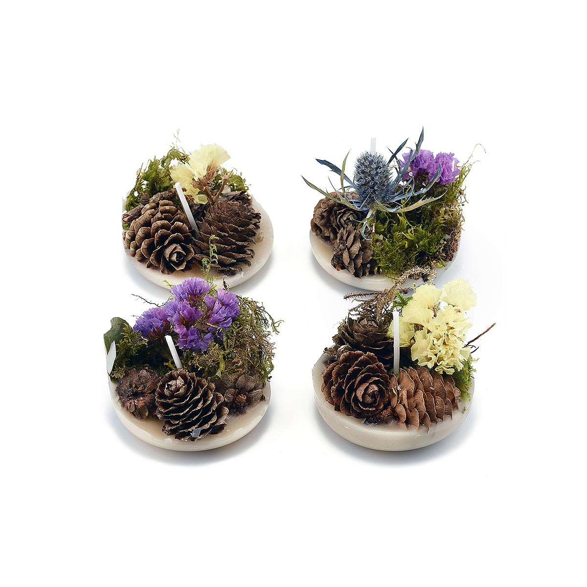 four decorated firelighters on white background