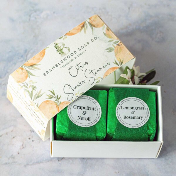 two wrapped shower cubes in a box