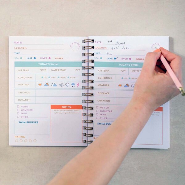 hand writing on open journal on table