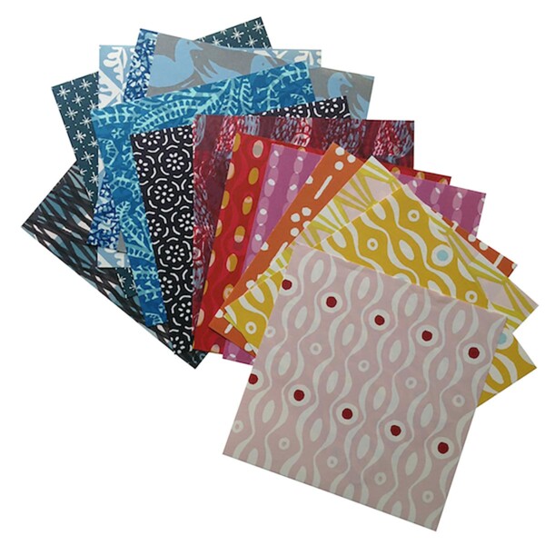 sheets of coloured paper on a white background