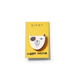 grumpy dog pin badge on white background