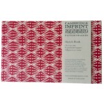 red patterned book on white background