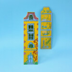 yellow dolls house on blue background