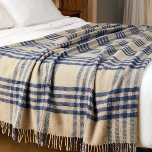 blue check throw on a large bed