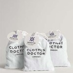 three small white sacks on a white background