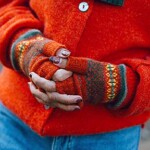 close up of hands wearing open mittens