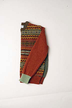 jumper folded in half on a white background