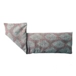 blush pink patterned wheat bag on a white background