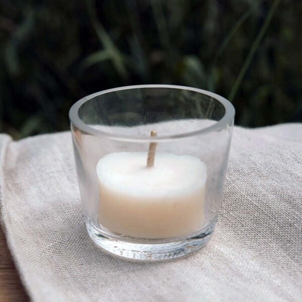 tea light cup on cloth on table