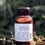 amber glass apothecary jar on fresh seaweed
