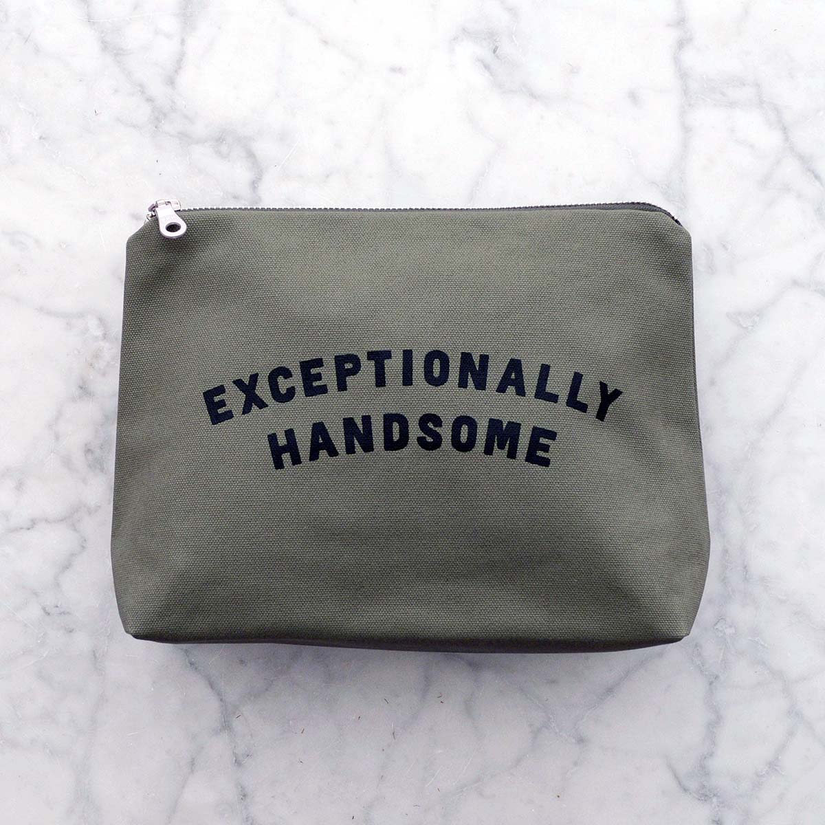 olive-green-exceptionally-handsome-wash-bag olive green wash bag on pale marble background