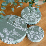 set of three bowls covered with bowl covers on a worktop