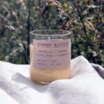 candle on a cloth covered table