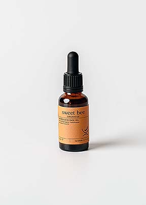 sweet-bee-organics-sacred-skin-face-oil glass bottle on white background