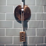 soap on a rope hanging from lever tap in shower