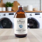labelled amber bottle on table in front of washing machine